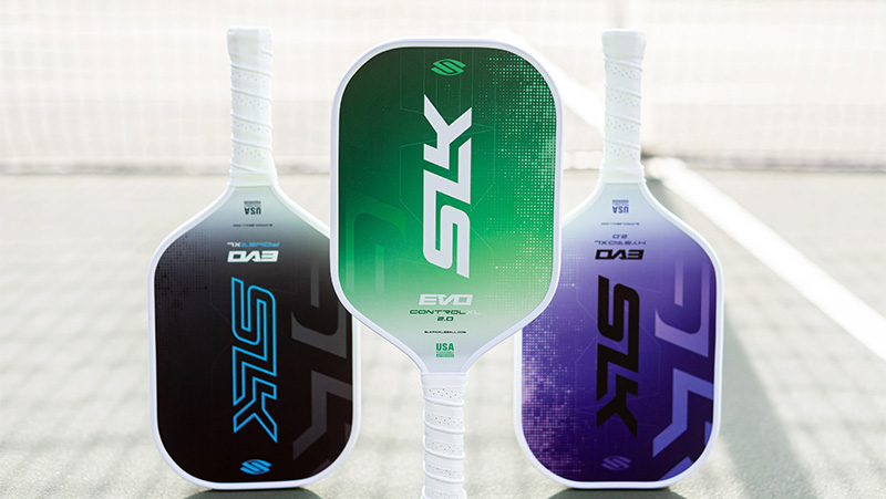 Selkirk Evo Pickleball paddles in black, purple, green colors with white handle and grip